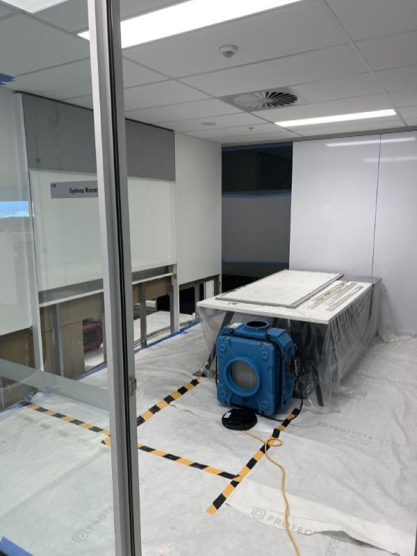 Completed room after strip-out and drying, with dehumidification equipment in place
