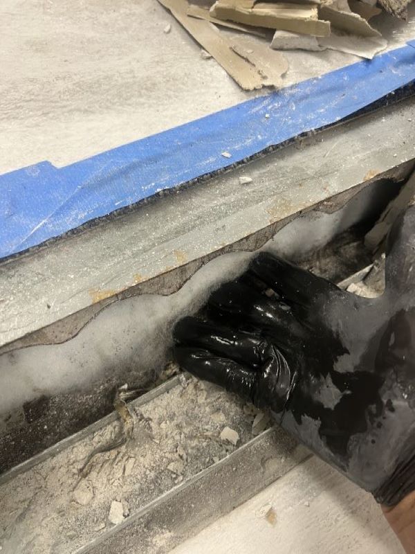 Wet saturated insulation inside floor cavity